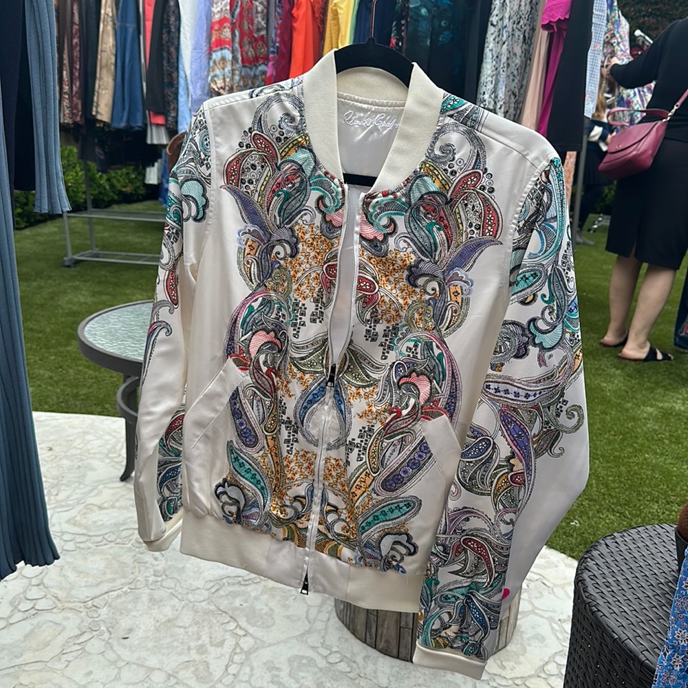 White bomber jacket with colorful print designs
